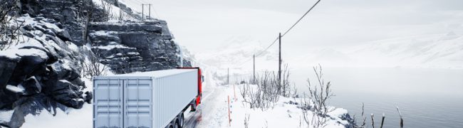 Red truck transport with container on winter road